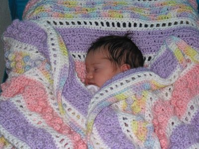 Cuddled up in Great Auntie Carla's Afghan!