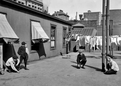 1910 - Playing marbles on the roof
