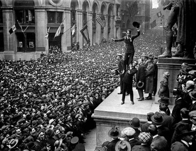 1918 - Charlie Chaplin held aloft by Douglas Fairbanks