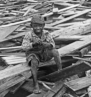 1900 - Sitting on hurricane debris