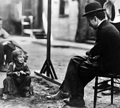 1921 - Jackie Coogan with Chaplin on the set of The Kid