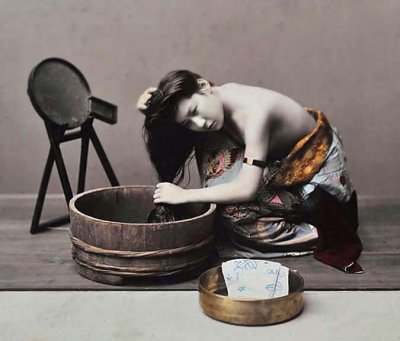 c. 1890 - Young woman washing her hair