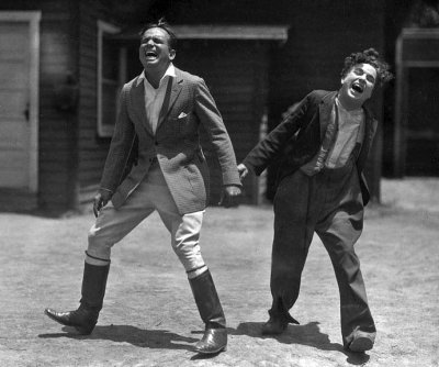 c. 1918 - Sharing a laugh off camera