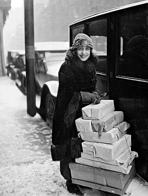 1920 - Anna Held with Christmas packages