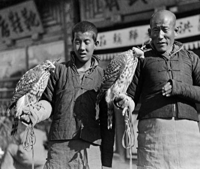 1917 - Men holding hawks