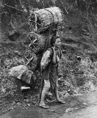 1890's - Woman delivering charcoal