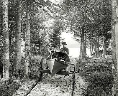 c. 1902 - Moving a canoe