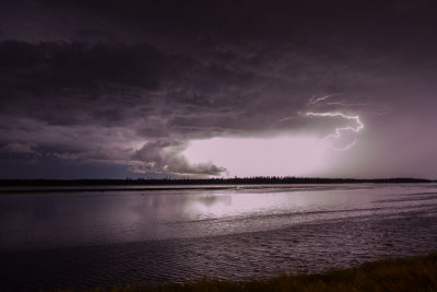 Dark clouds and lightning over the Moose River 2013 July 31.