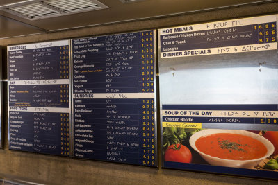 Part of menu posted in Cree and English in Ontario Northland Railway snack car 701.