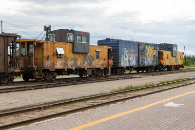 Cabooses 1873 and 124 at the end of a ballast train in Cochrane