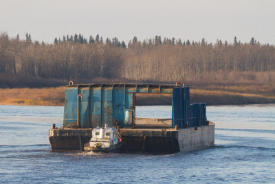 Tug Harricana River pushing a barge up the Moose River to winter storage