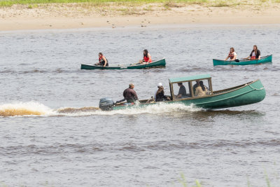 Paddle canoes and a taxi boat on the Moose River.