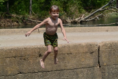 Adrian Jumping Into Water from Ponca Bridge