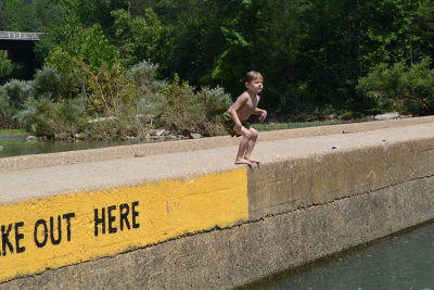 Adrian Jumping Into Water from Ponca Bridge