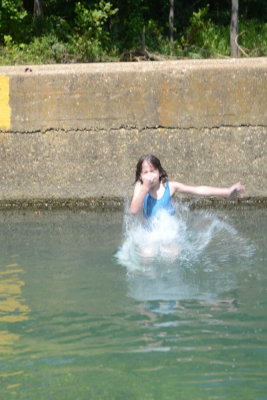 Helen Jumping in At Ponca Access Bridge