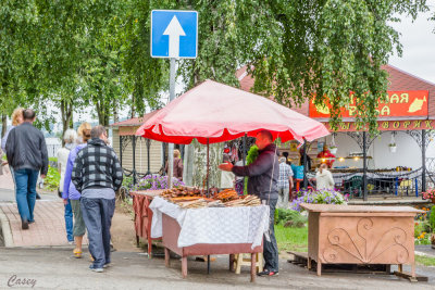 A fish vendor waits for the crowd.
