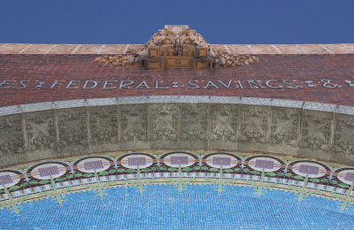 Geometric border of mosaic half-round with ornament above