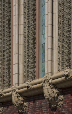 Terra cotta ornament below and between stained glass windows