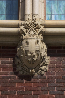 Terra cotta ornament below stained glass windows