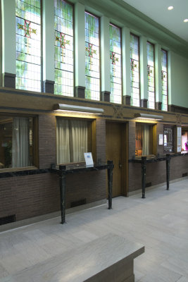 Wall of stained glass windows toward front