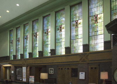 Wall of stained glass windows toward rear