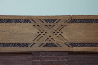 Oak horizontal trim with X ornament and terra cotta bands