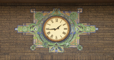 Clock with tile pattern below rose window