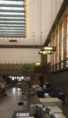 Side of bank interior, with stained glass windows and skylight