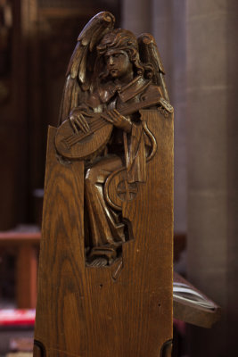 Choir Pew End: Angel Playing Lute