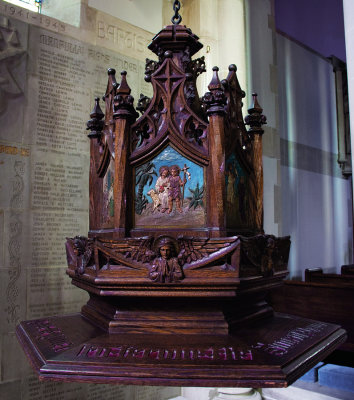 Bapistry: decorative carved font cover