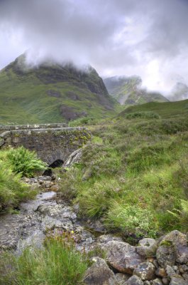 Mist lifting off the three sisters in Glen Coe
