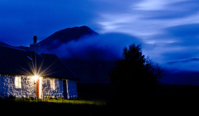 Black Rock Cottage at night and Buachaille Etive Mor in the background