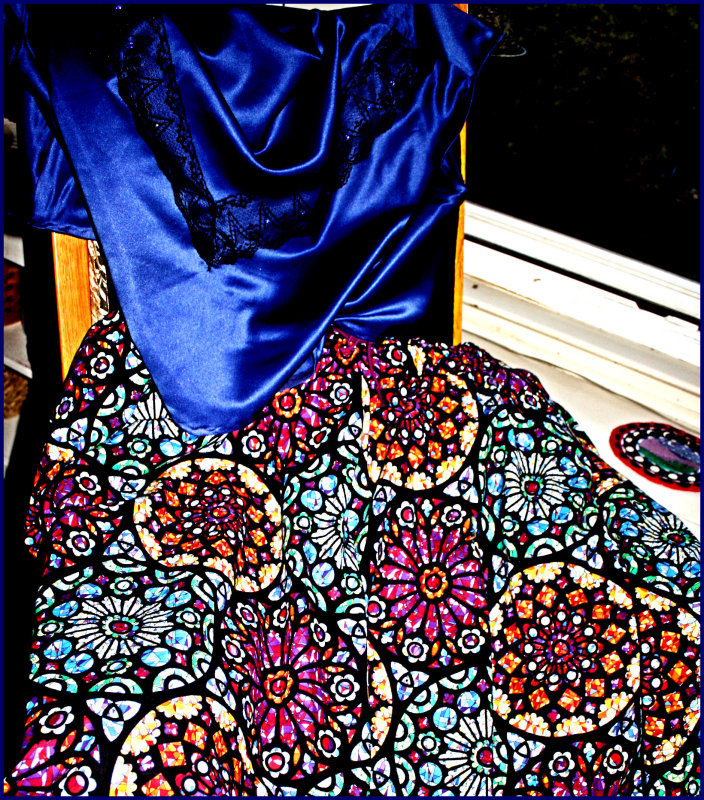 Satin blouse and rose window circular skirt.