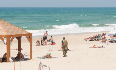 Soldier at the beach of Tel Aviv