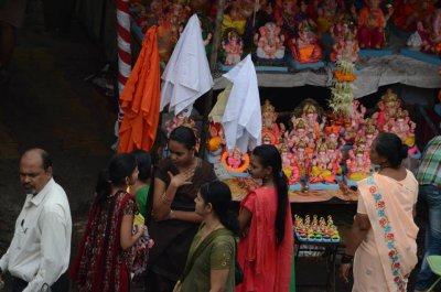 Men and women shopping for Ganesha idols before the festival starts