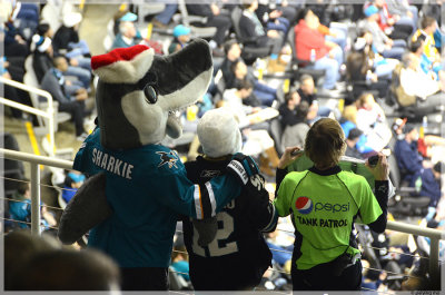 Sharkie dons a Santa hat while a fan is taking a quiz