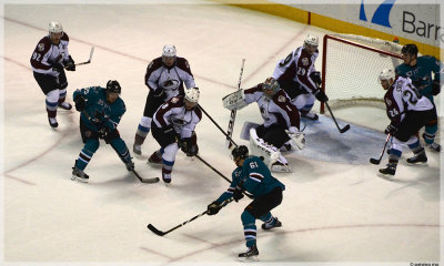  Couture has many scoring opportunities, but not this one (puck over shoulder of #61)