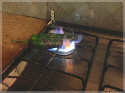 Vegetables are roasted on a gas stove