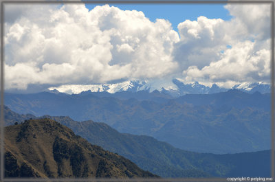 Low hanging clouds and snow packed peaks now are one