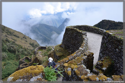 The ruins of Phuypatamarca half covered in clouds