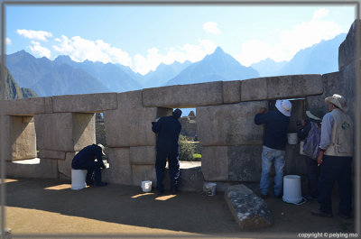 Workers are polishing stones at the Temple of Three Windows