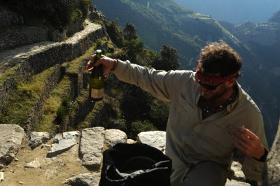 Pop!  Champaign cheers at Sun Gate. Machu Picchu in the background