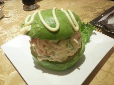 Green burger - seafood sandwiched between avocado halves