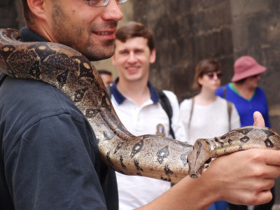 man with snake, prague