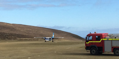 Plane landing at Fair Isle airstrip