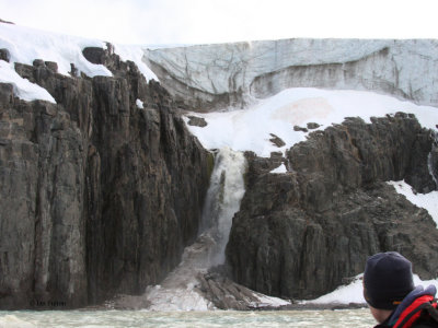 A glacier melt waterfall at Alkefjellet, Svalbard