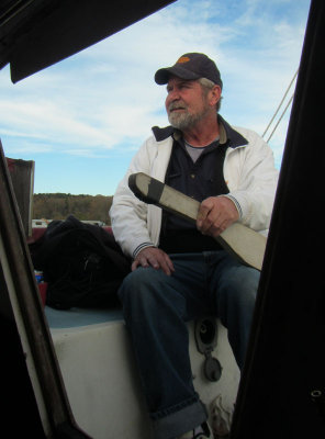 Captain TC on tiller.jpg