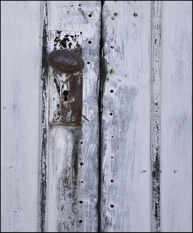 Church door peppered with shot