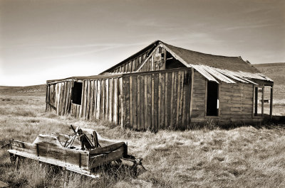 Buckboard and house