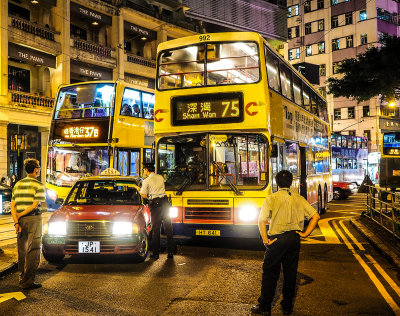 Streets of Hong Kong - my bus crunches a Hong Kong taxi